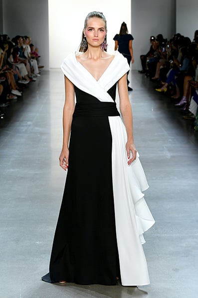 BLACK/ IVORY TEXTURED CREPE GOWN WITH PORTRAIT COLLAR AND CASCADING RUFFLE DETAIL